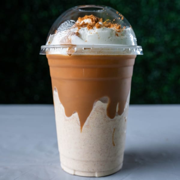 Ranoush dessert: a milkshake with caramel drizzle, whipped cream, and cookie crumbles.